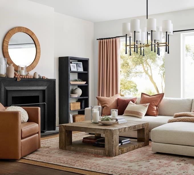 A living room with fireplace and neutral seating