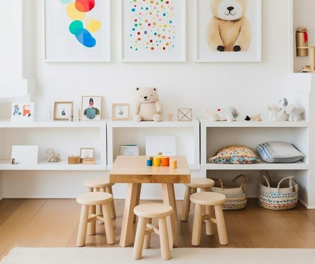 A children's playroom with labeled storage